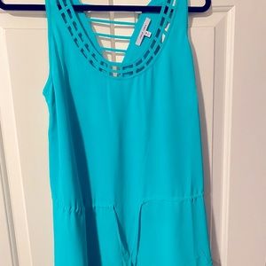 Naked zebra adjustable peplum, cut out back and caged design green blouse